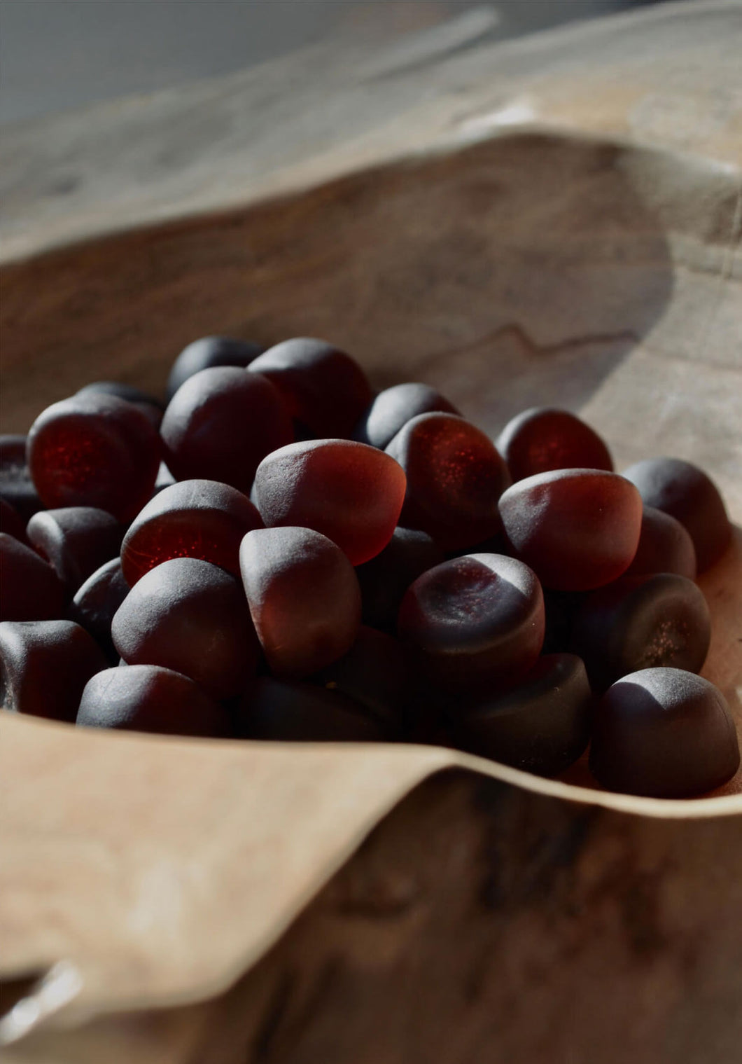 Bowl of dark red gummies